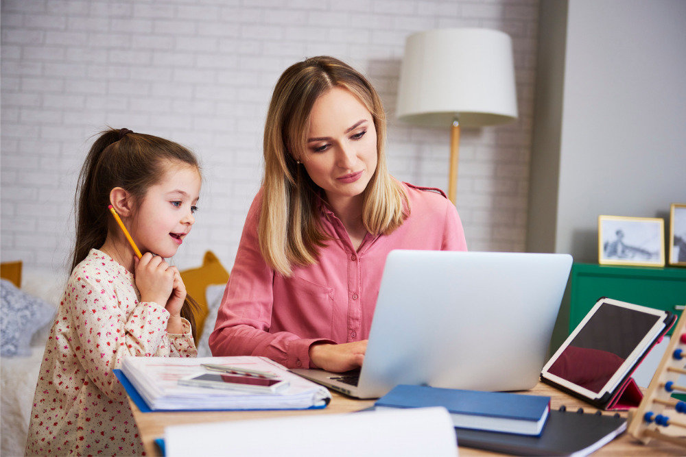 young mother working from home with daughter picture id1135473872 d 850